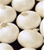 Freshly harvested Crystal Wax White Bermuda onions with white, flat-globe shaped bulbs
